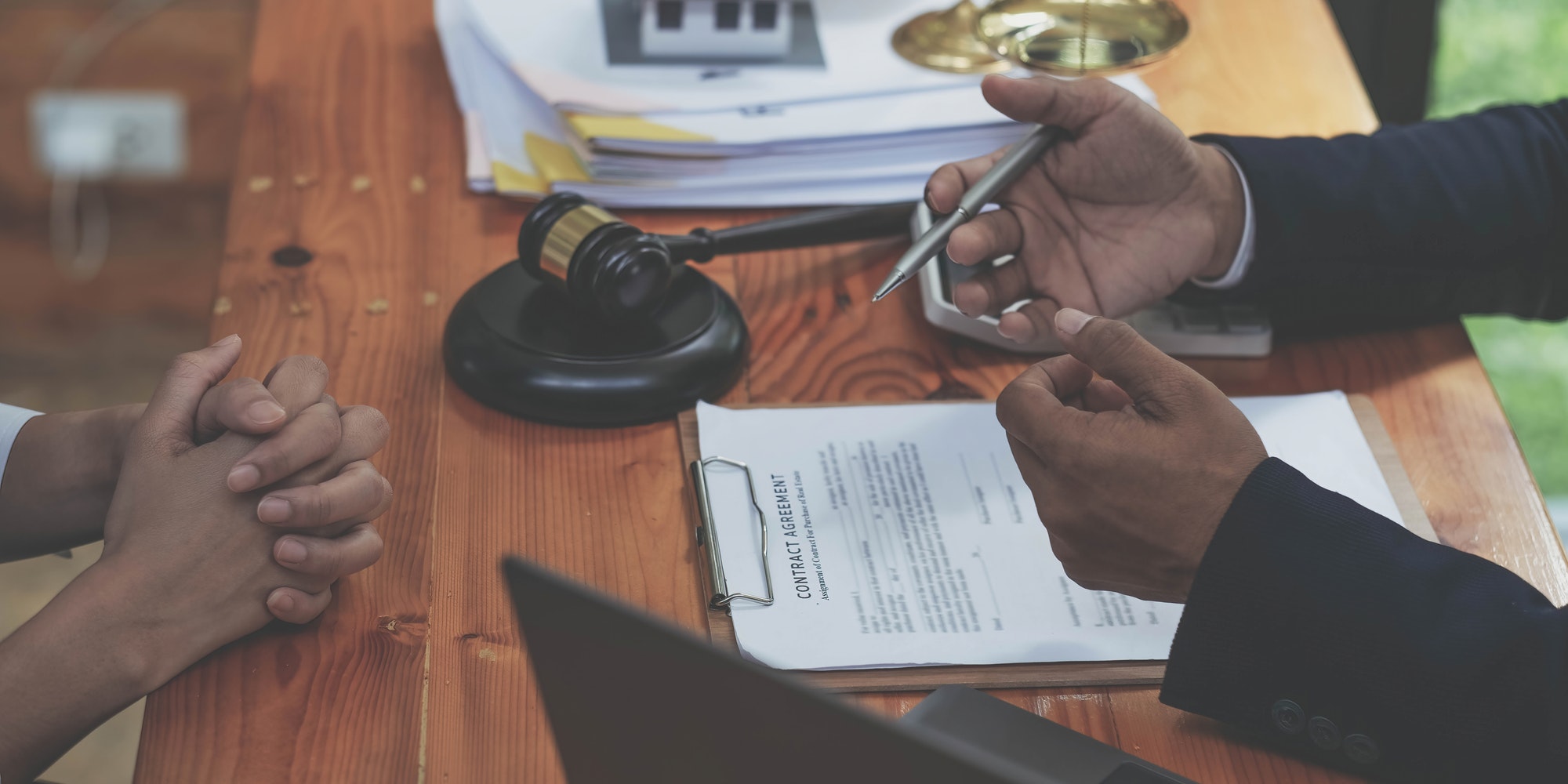 Business people negotiating a contract. man hands working with documents at desk and signing contrac